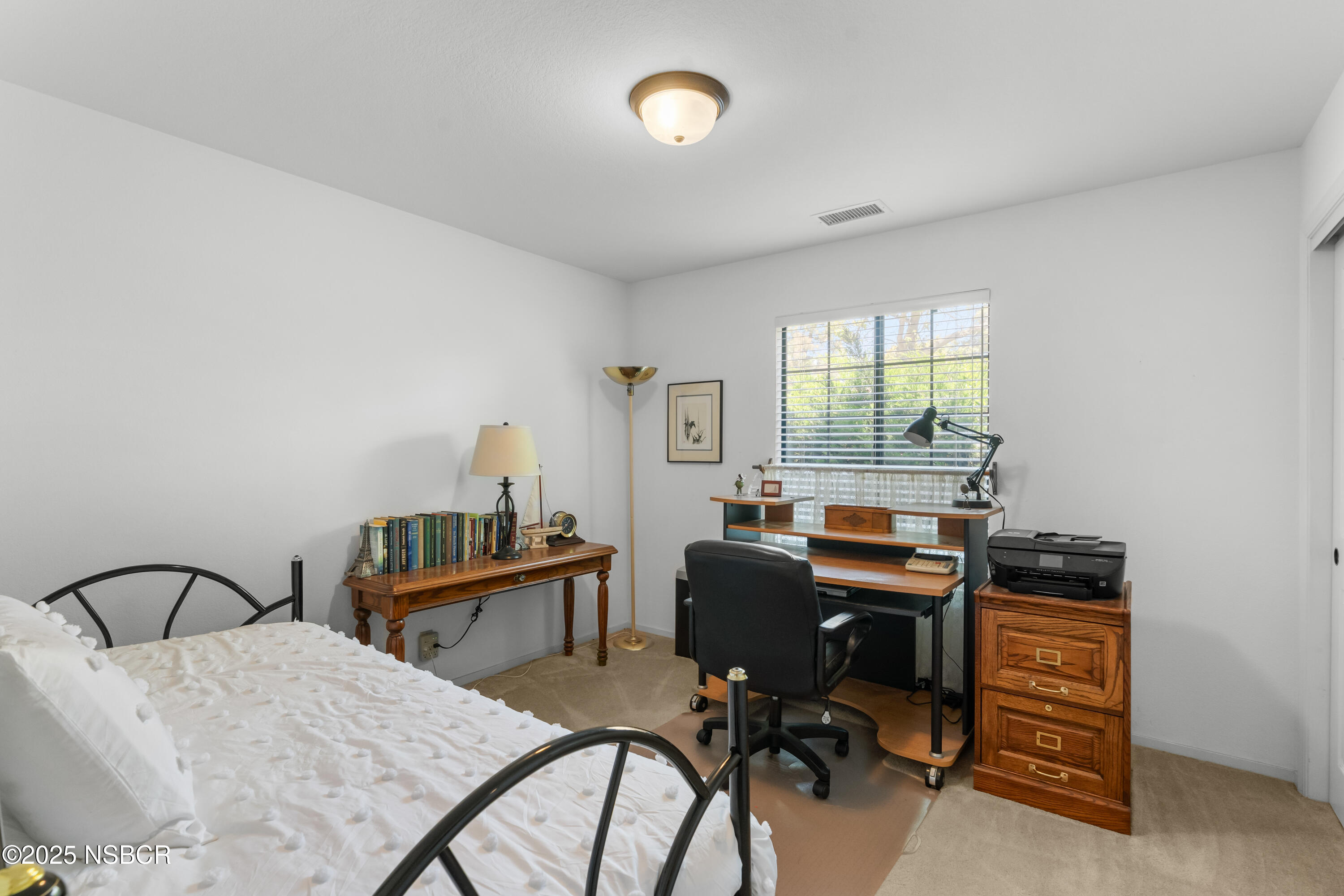 181 Eucalyptus Road Nipomo, CA 93444 - Photo 16 of 36 a view of a workspace with furniture and a window