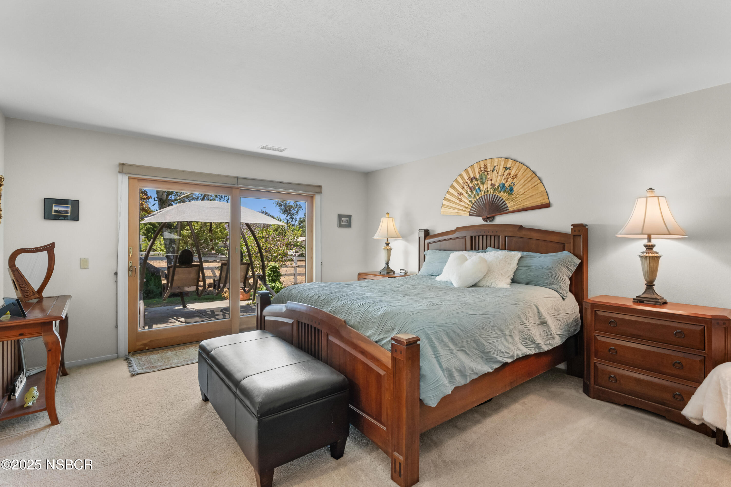181 Eucalyptus Road Nipomo, CA 93444 - Photo 18 of 36 a bedroom with a bed and a couch