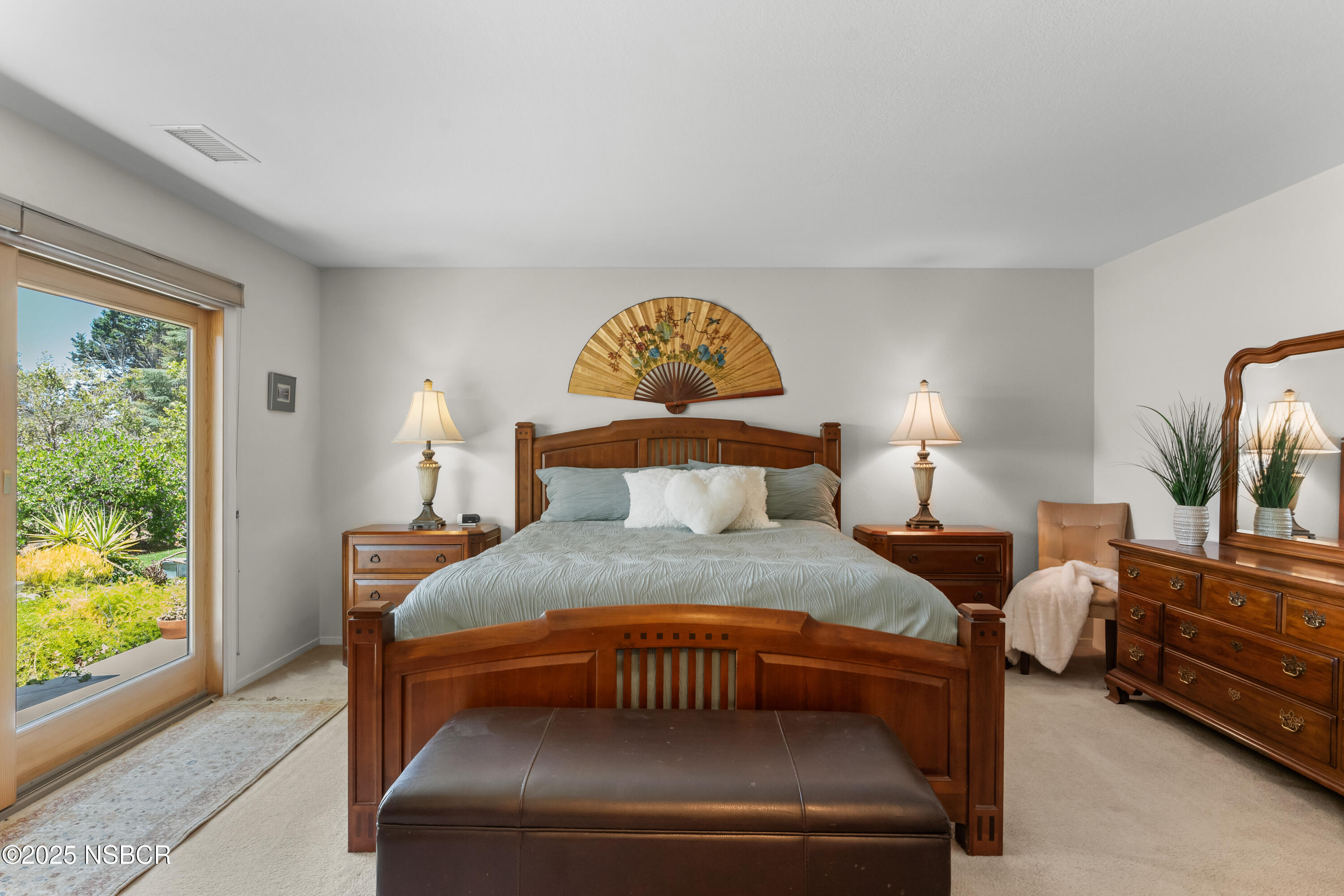 181 Eucalyptus Road Nipomo, CA 93444 - Photo 19 of 36 a bedroom with a bed and a large window