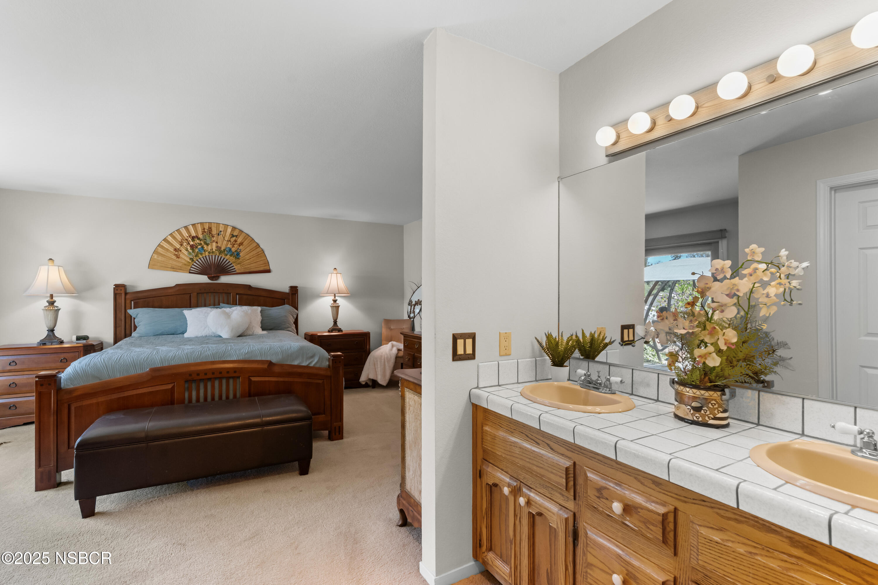 181 Eucalyptus Road Nipomo, CA 93444 - Photo 20 of 36 a bedroom with a bed and a lamp on dresser