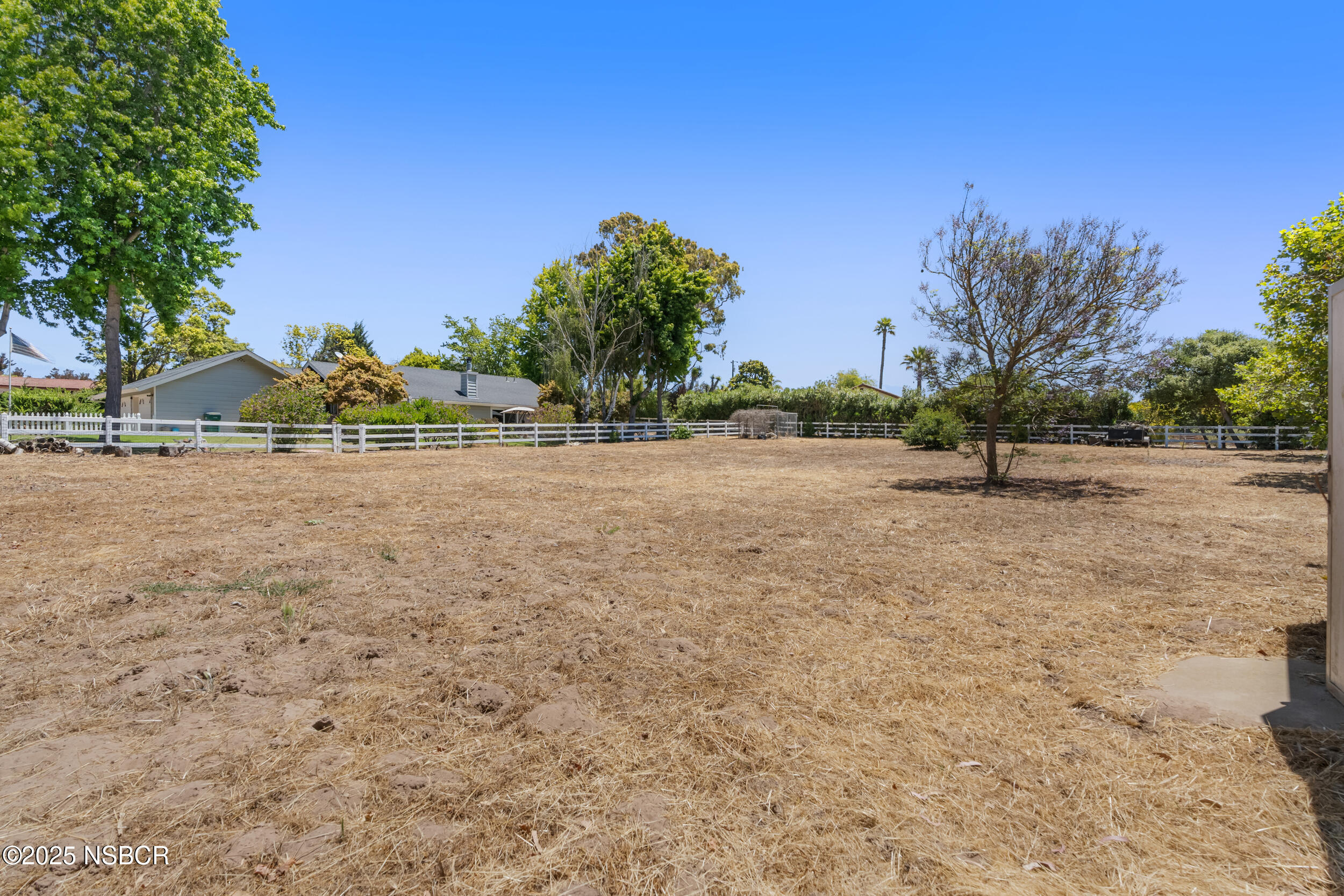 181 Eucalyptus Road Nipomo, CA 93444 - Photo 30 of 36 a view of dirt field with trees in the background