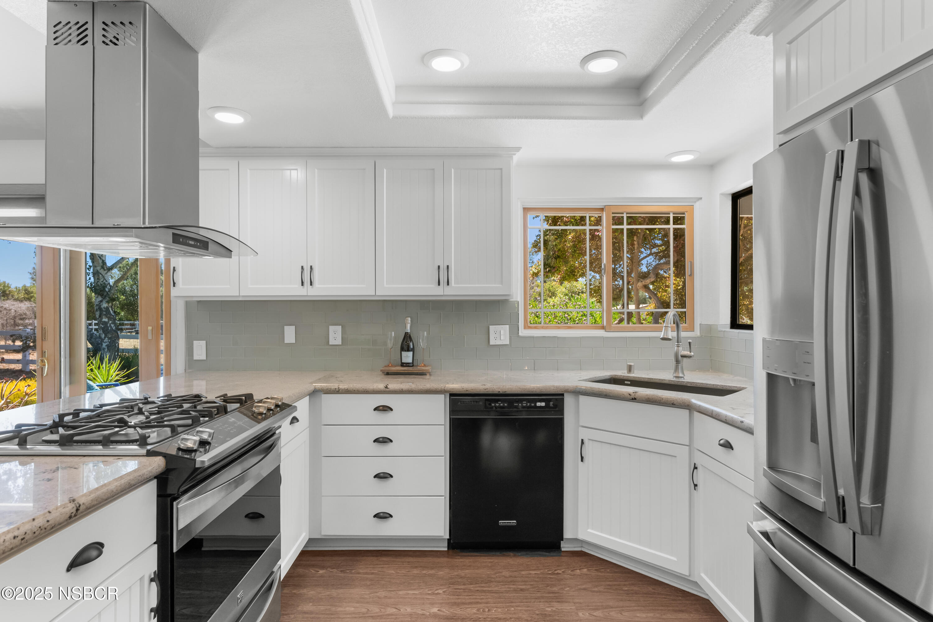 181 Eucalyptus Road Nipomo, CA 93444 - Photo 8 of 36 a kitchen with granite countertop a sink stainless steel appliances and cabinets