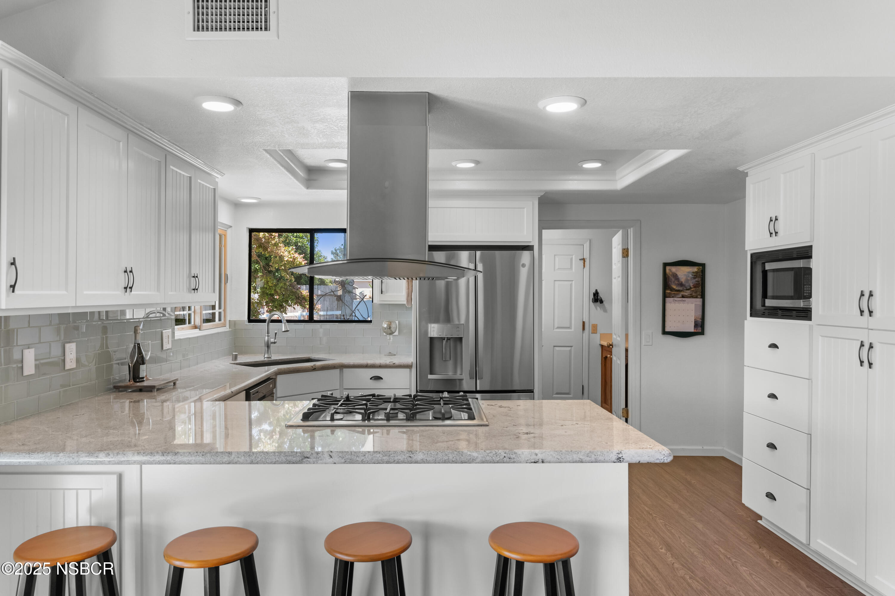 181 Eucalyptus Road Nipomo, CA 93444 - Photo 9 of 36 a kitchen with stainless steel appliances granite countertop a sink and a refrigerator