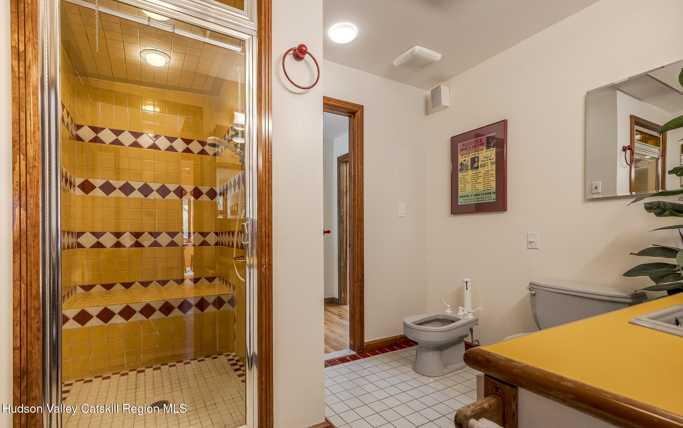 128 Newcut Road Woodstock, NY 12498 - Photo 22 of 51 a bathroom with a sink a toilet and shower curtain