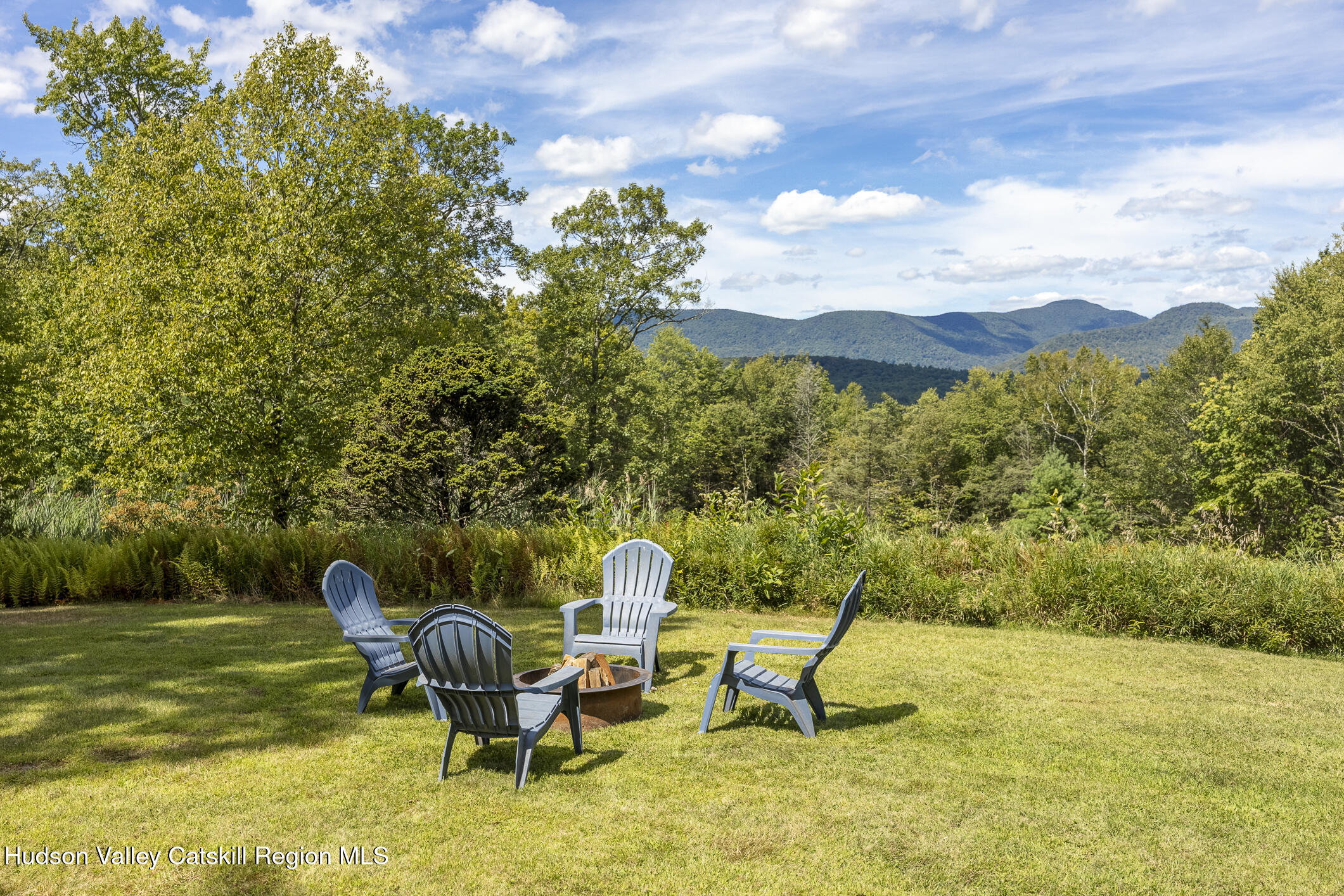 128 Newcut Road Woodstock, NY 12498 - Photo 28 of 51 a view of a lake with a yard and a garden