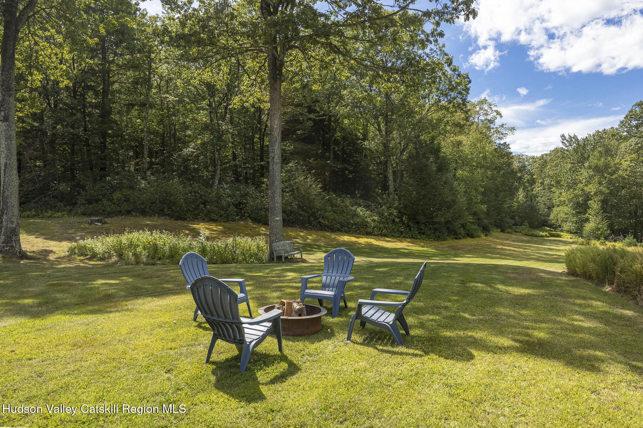 128 Newcut Road Woodstock, NY 12498 - Photo 34 of 51 a view of a swimming pool with a lounge chair