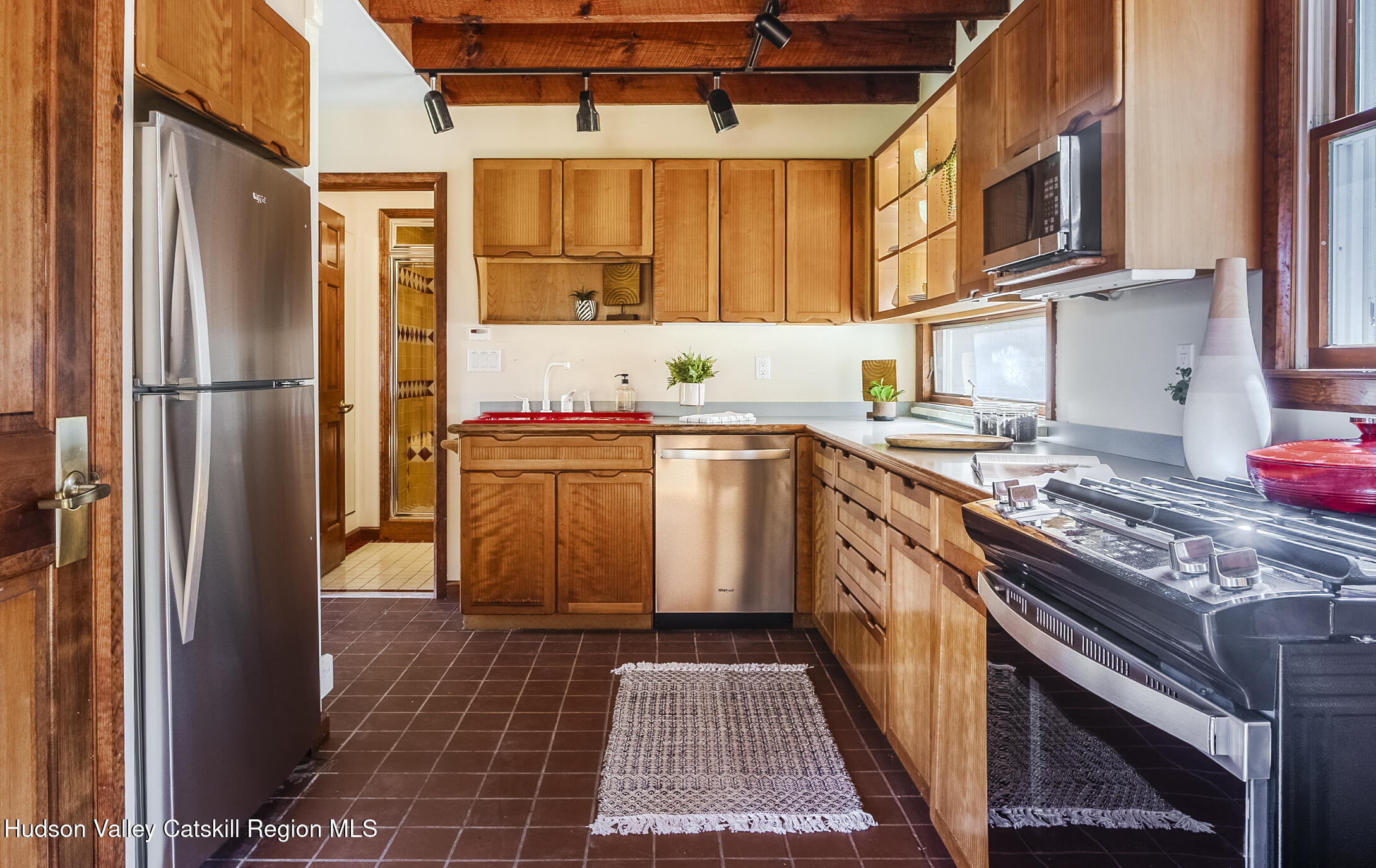 128 Newcut Road Woodstock, NY 12498 - Photo 6 of 51 a kitchen with stainless steel appliances granite countertop a stove a sink dishwasher and a refrigerator