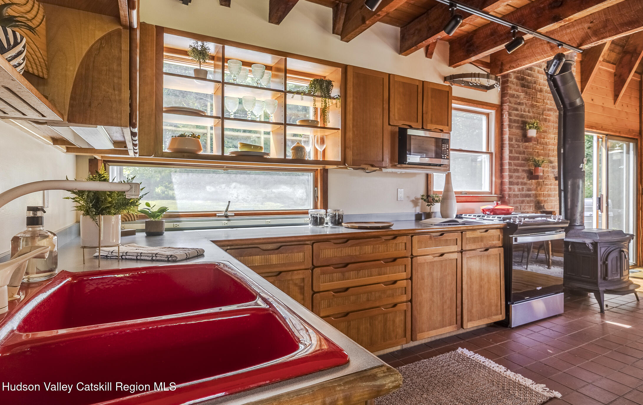 128 Newcut Road Woodstock, NY 12498 - Photo 7 of 51 a kitchen with stainless steel appliances kitchen island granite countertop a sink and cabinets