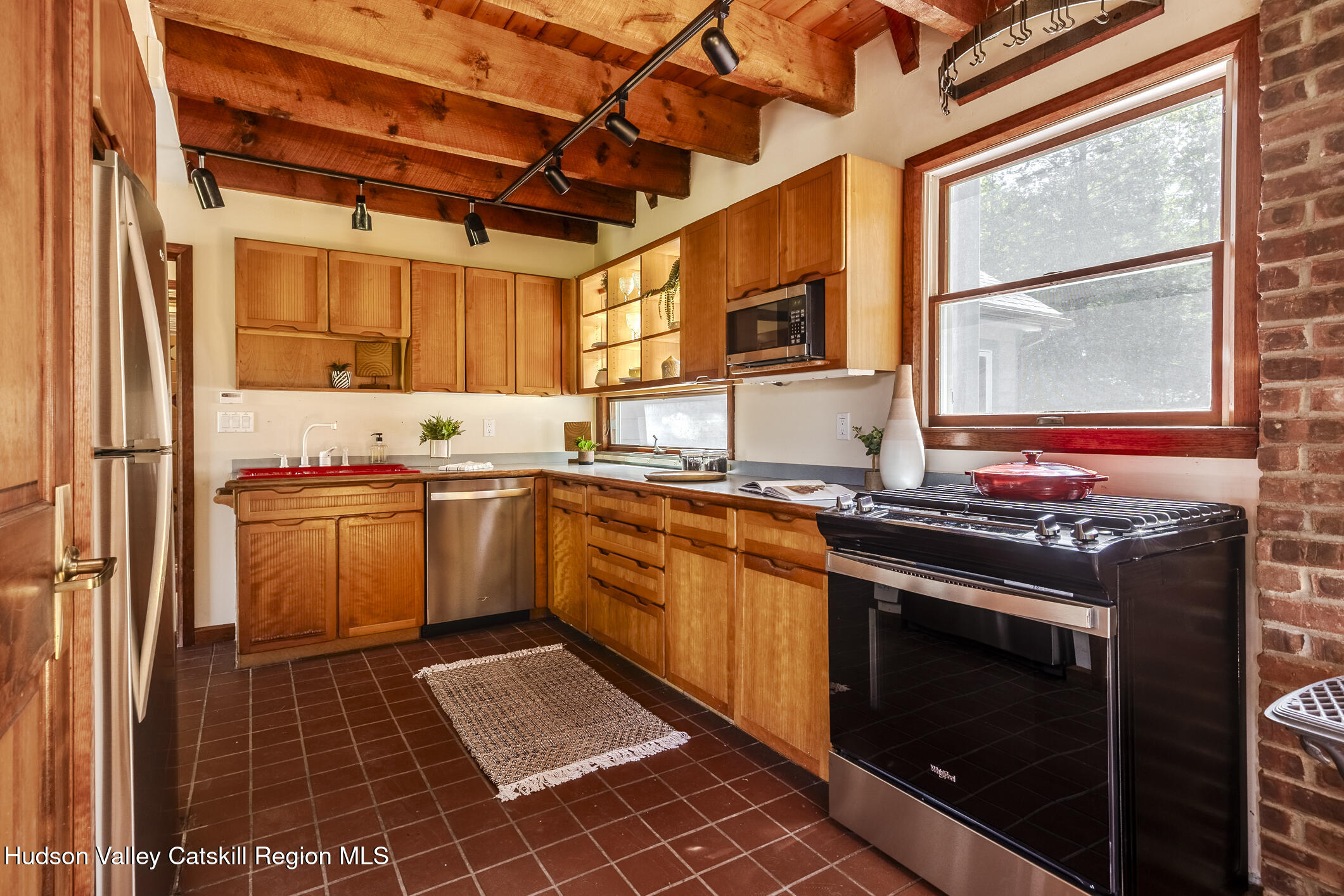 128 Newcut Road Woodstock, NY 12498 - Photo 8 of 51 a kitchen with stainless steel appliances granite countertop a stove a sink and a microwave