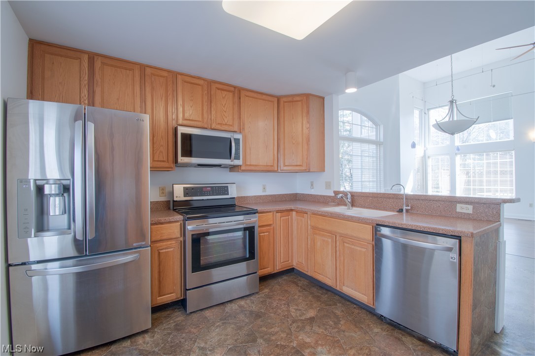 105 Furnace Run Road, Unit 105 Akron, OH 44307 - Photo 7 of 22 The eat-in kitchen provides a built-in desk, stainless steel appliances, a breakfast bar, and a large bay window for even more natural light.