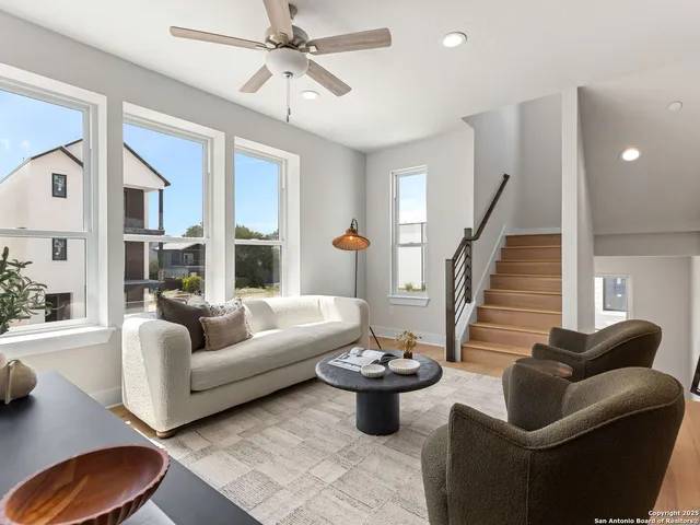 a living room with furniture and a large window
