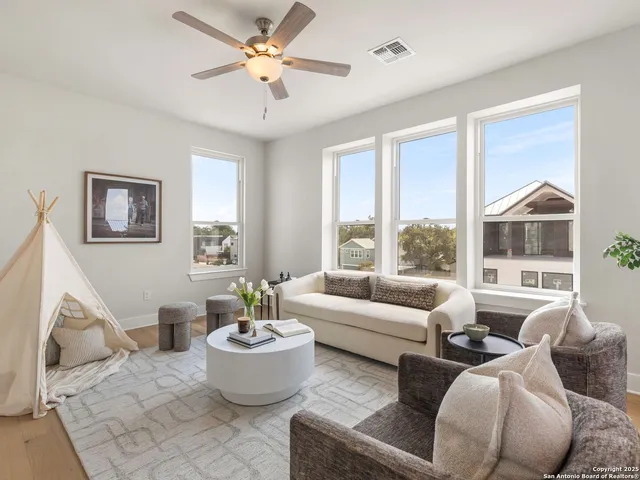 a living room with furniture and a large window