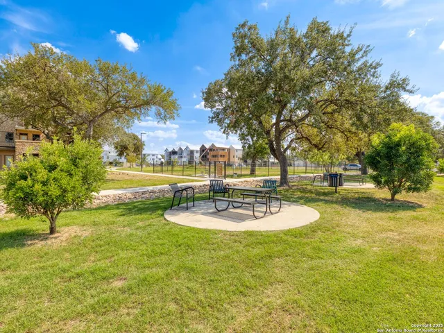 a view of a swimming pool with a yard