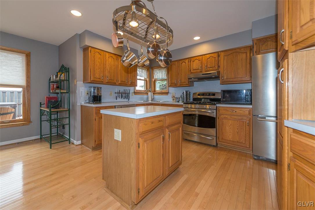 864 Lahr Road Nazareth, PA 18064 - Photo 6 of 34 a kitchen with stainless steel appliances granite countertop a sink a stove and refrigerator