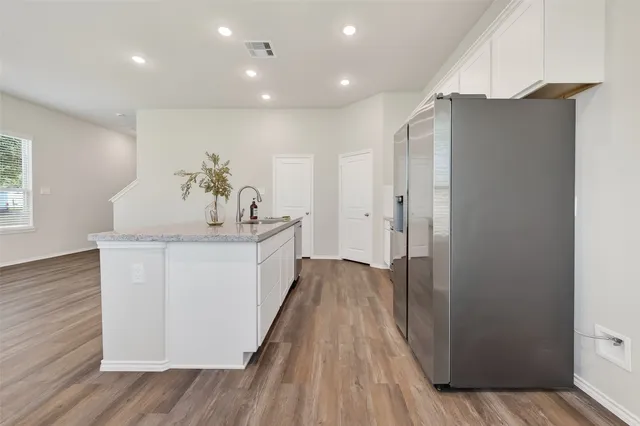 a bathroom with a sink and mirror