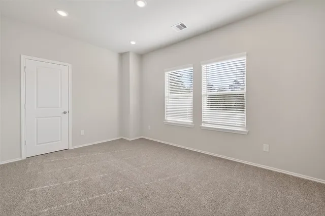 an empty room with windows