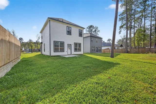 a big house with a big yard and more windows
