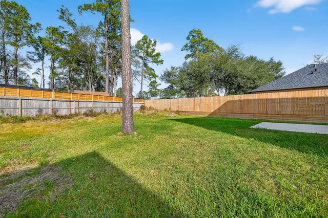 a view of a swimming pool with a big yard