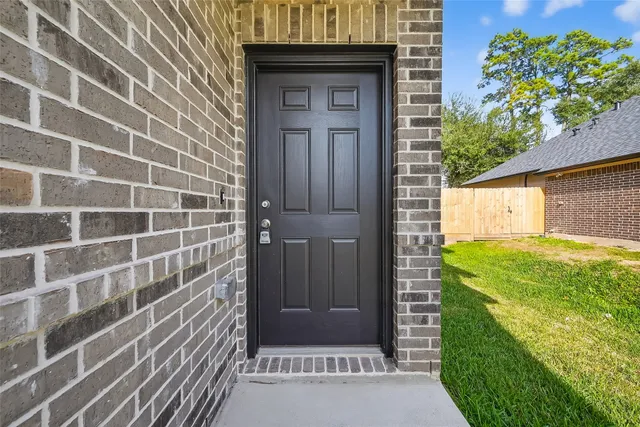 a bathroom with a shower and a sink