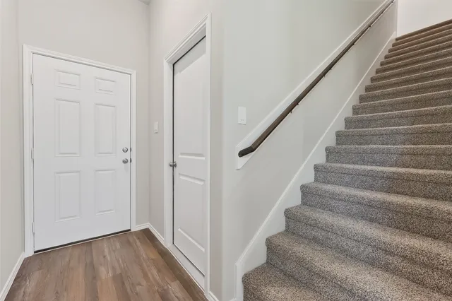 a view of entryway with wooden floor