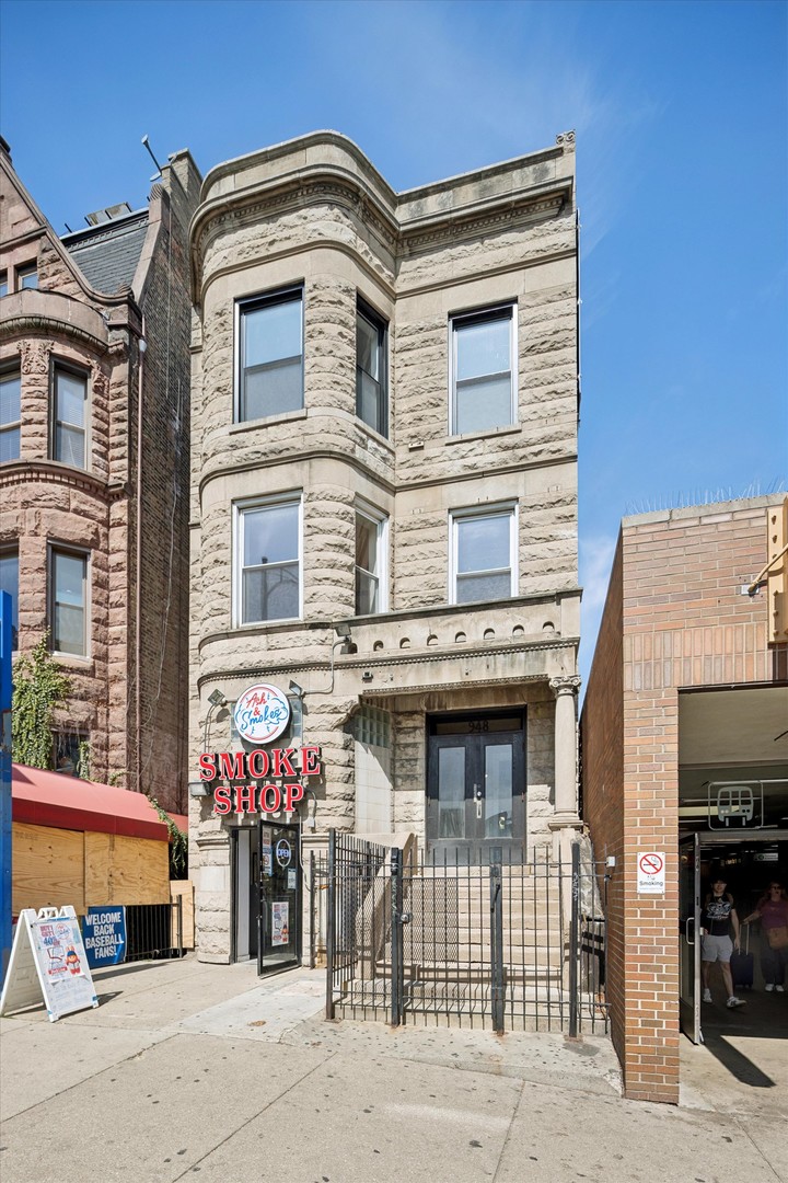 948 West Addison Street, Unit 3 Chicago, IL 60613 - Photo 1 of 11 a front view of a building with parking