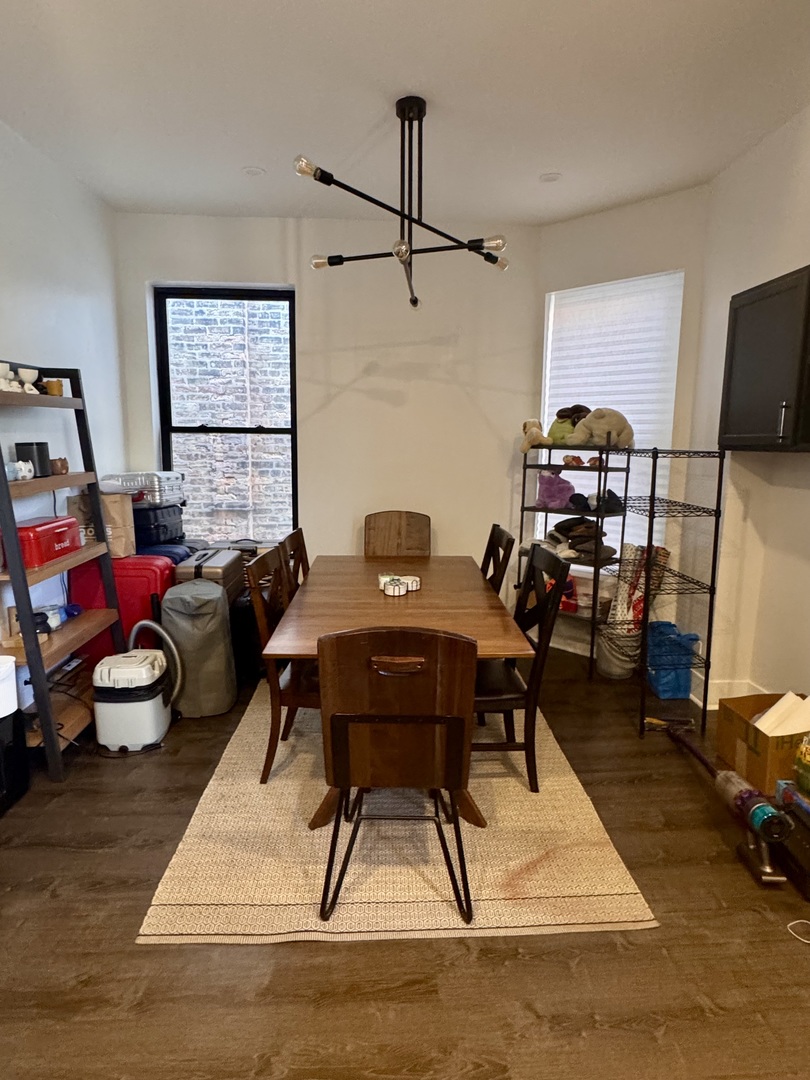 948 West Addison Street, Unit 3 Chicago, IL 60613 - Photo 8 of 11 a living room with furniture a rug and a window