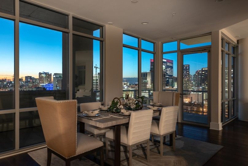 a view of a dining room with furniture window and wooden floor