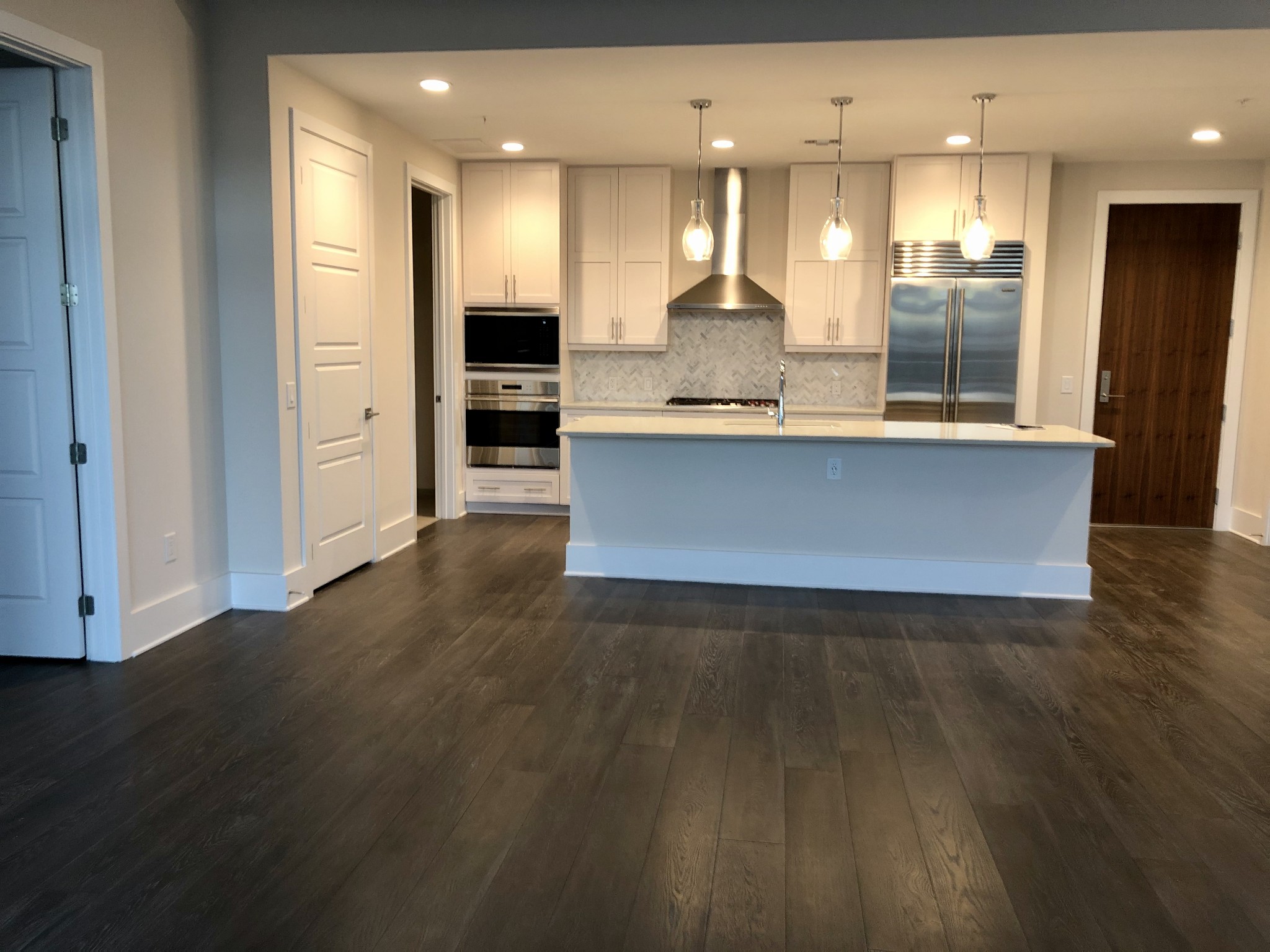 20 Rutledge Street, Unit 603 Nashville, TN 37210 - Photo 11 of 27 a large kitchen with lots of counter space and a sink