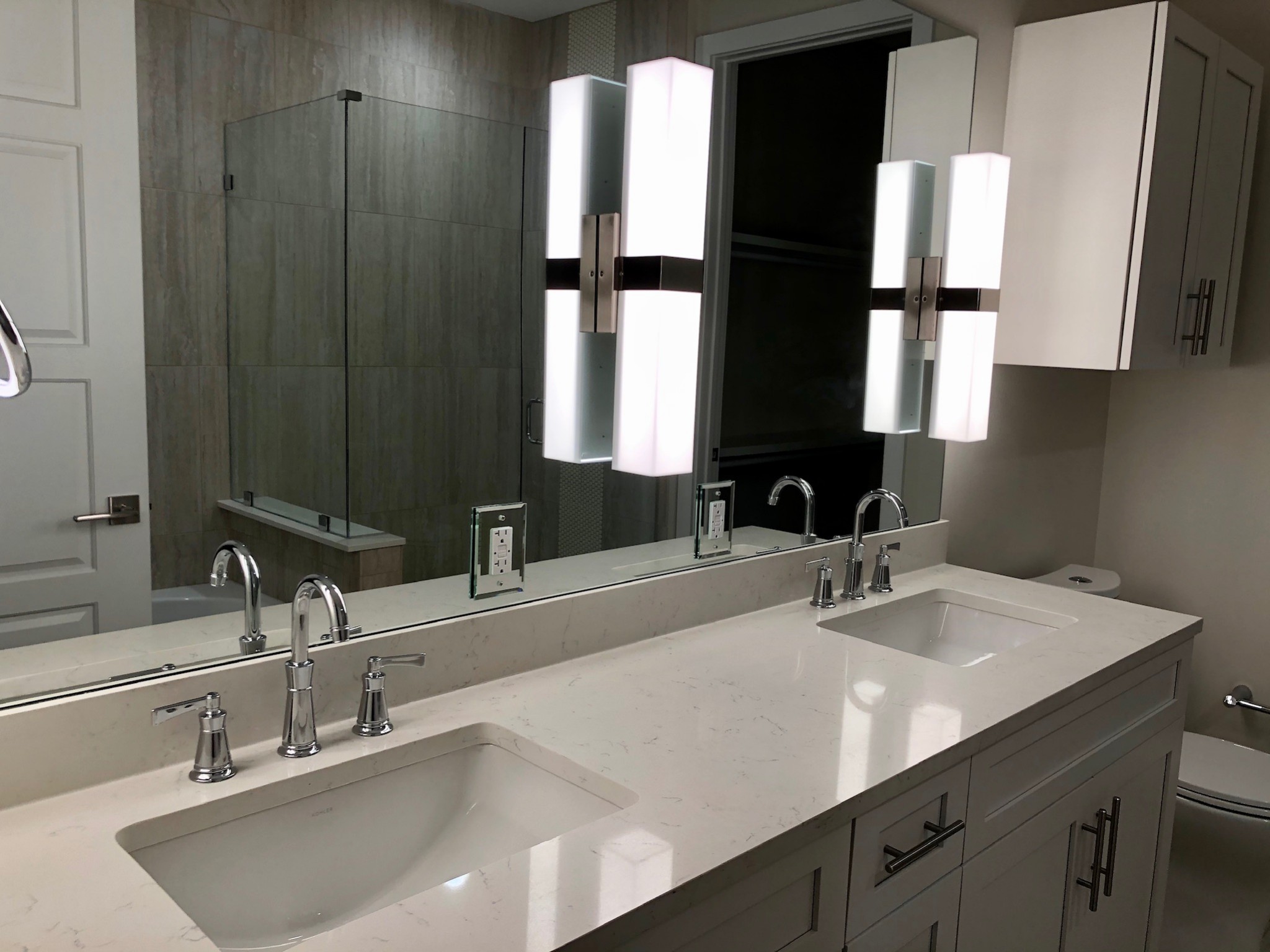 20 Rutledge Street, Unit 603 Nashville, TN 37210 - Photo 18 of 27 a bathroom with double vanity and a mirror