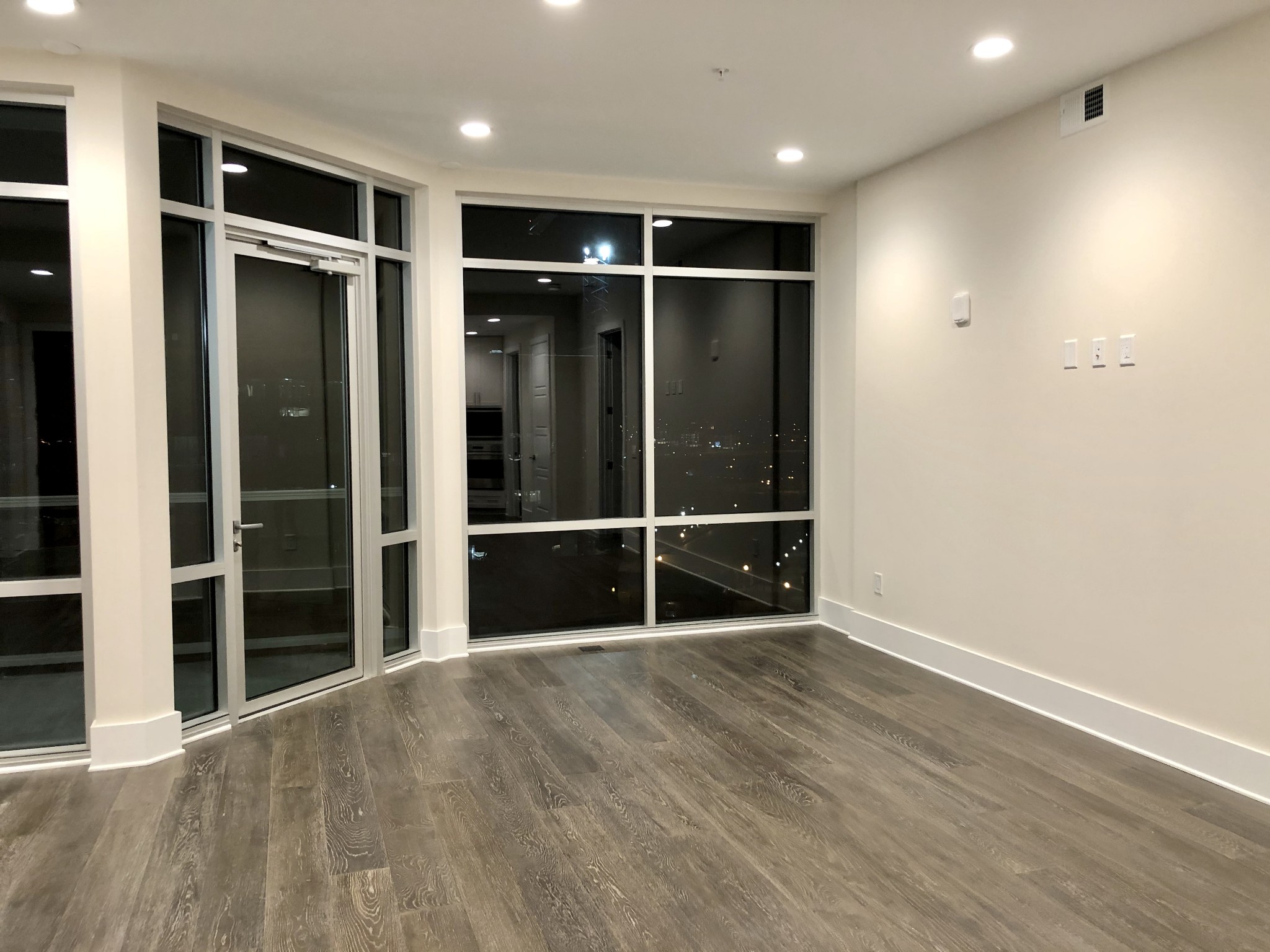 20 Rutledge Street, Unit 603 Nashville, TN 37210 - Photo 2 of 27 a view of empty room with wooden floor