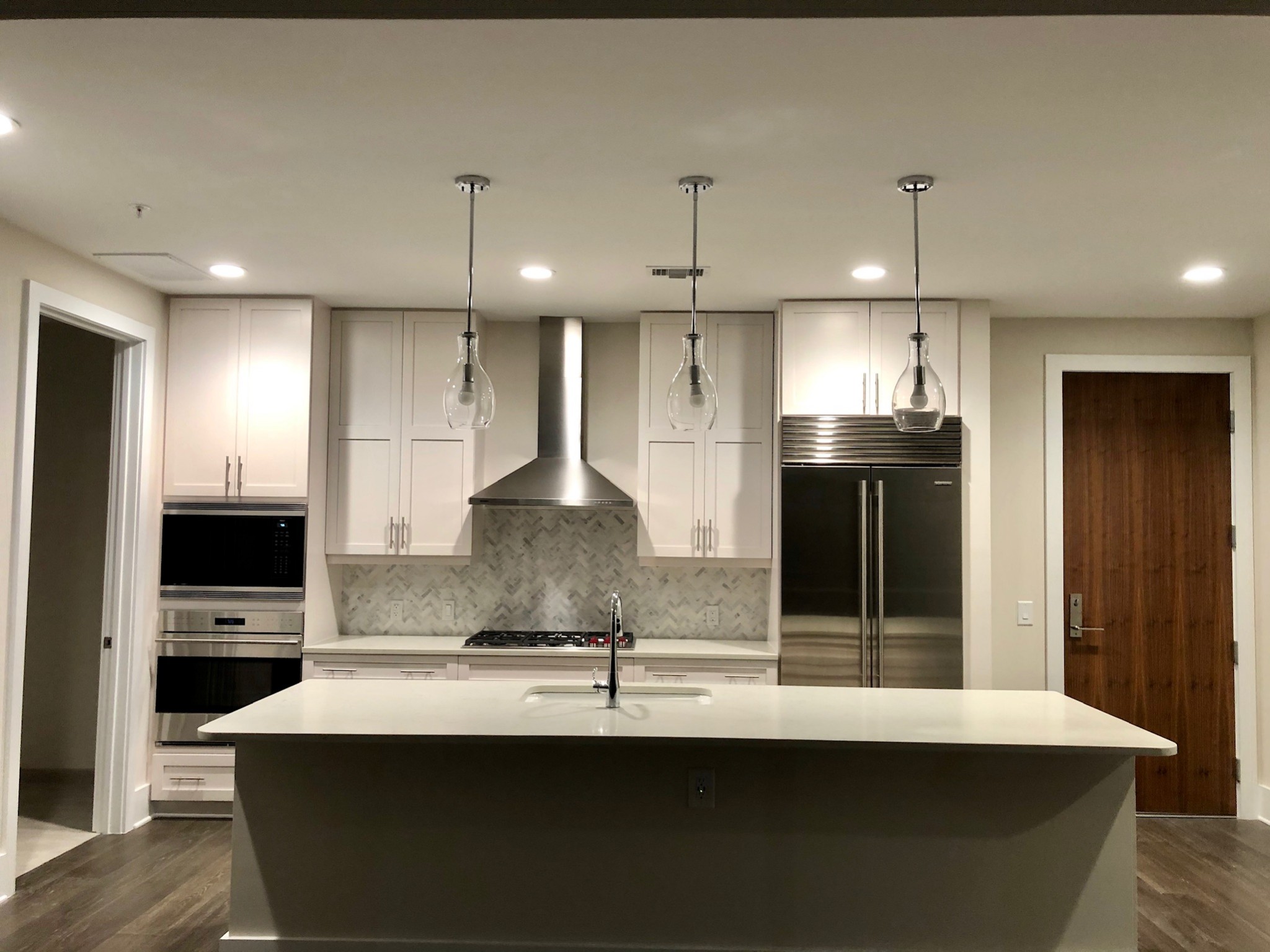 20 Rutledge Street, Unit 603 Nashville, TN 37210 - Photo 3 of 27 a kitchen with kitchen island stainless steel appliances a sink stove and refrigerator