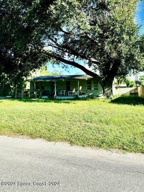 1630 Pine Hill Drive Melbourne, FL 32935 - Photo 2 of 2 a view of a house with garden and trees