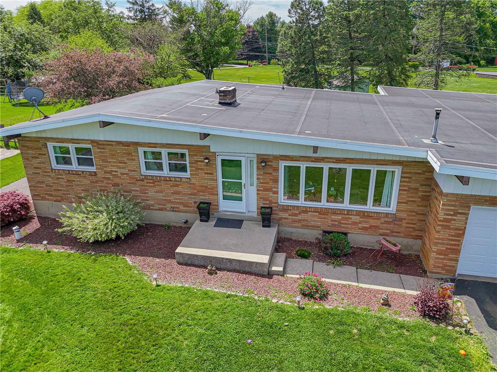 579 Cherry Road Northampton, PA 18067 - Photo 9 of 57 A well-maintained brick exterior with lush landscaping creates a welcoming curb appeal.