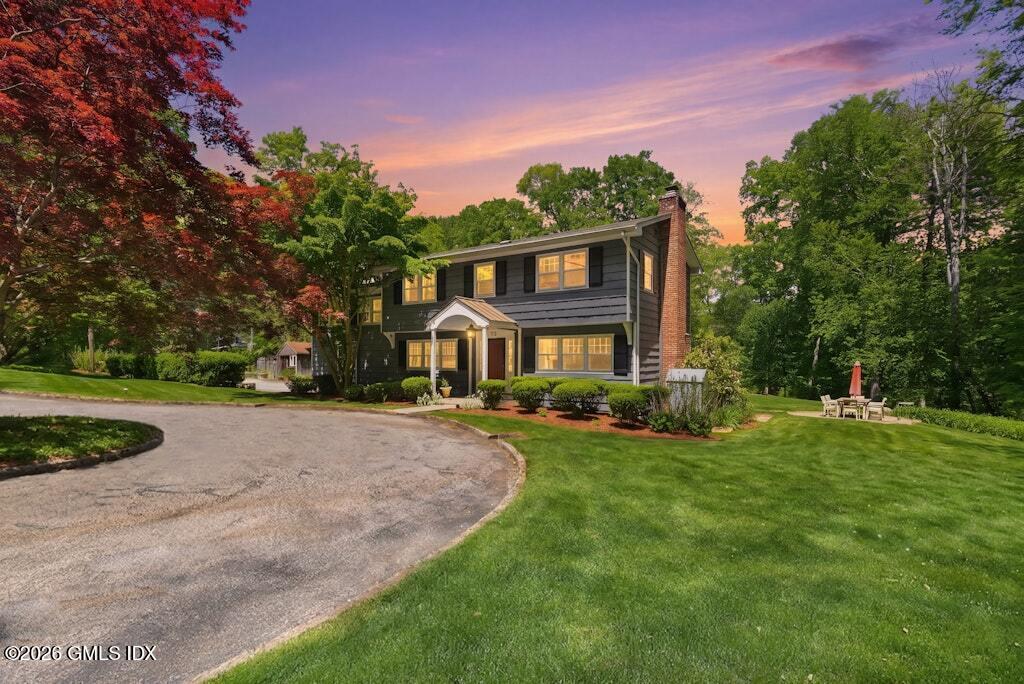 73 Thunder Mountain Road Greenwich, CT 06831 - Photo 1 of 19 a front view of a house with a yard