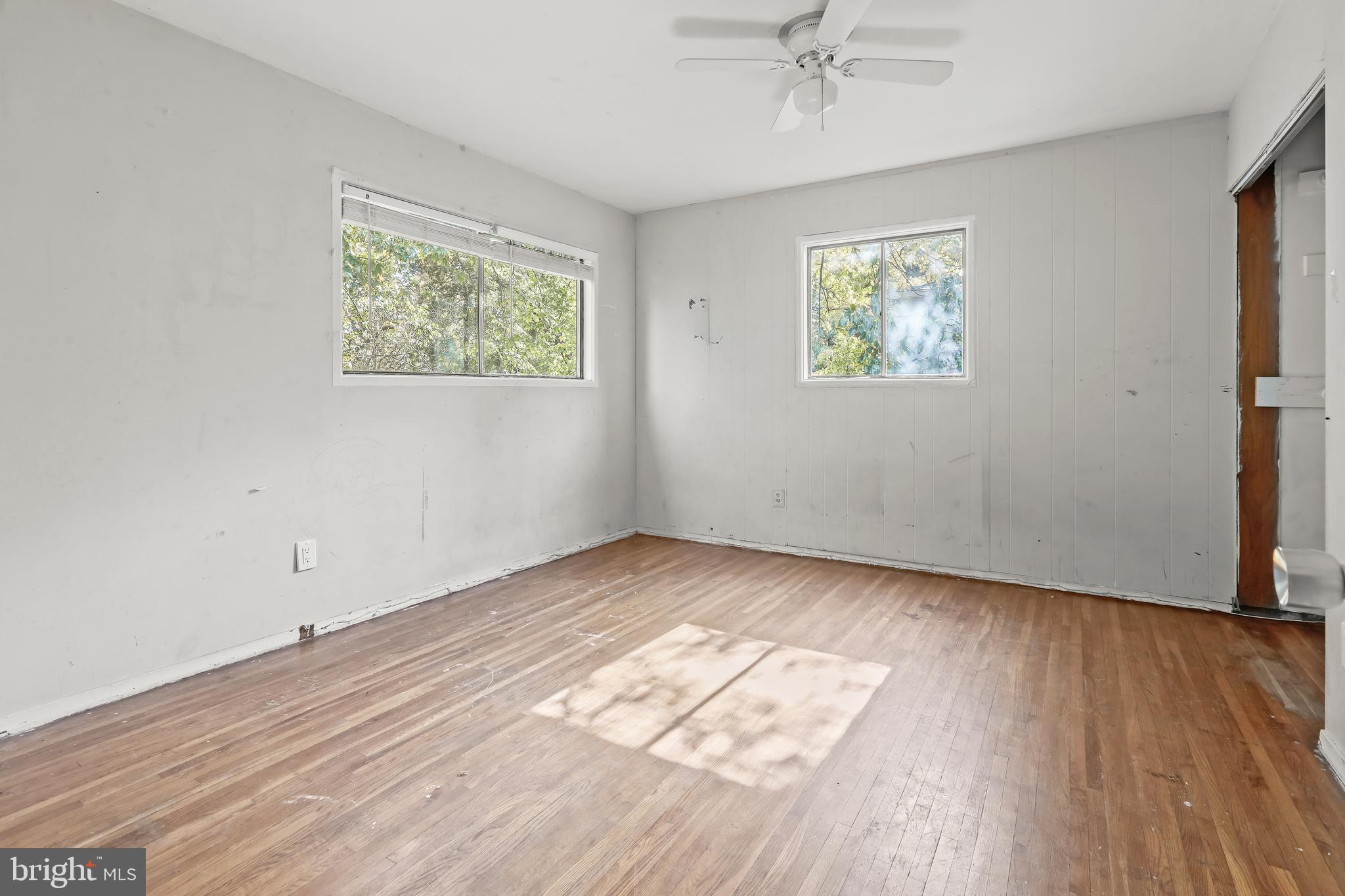 2217 Columbia Place Landover, MD 20785 - Photo 13 of 34 wooden floor in an empty room with a window