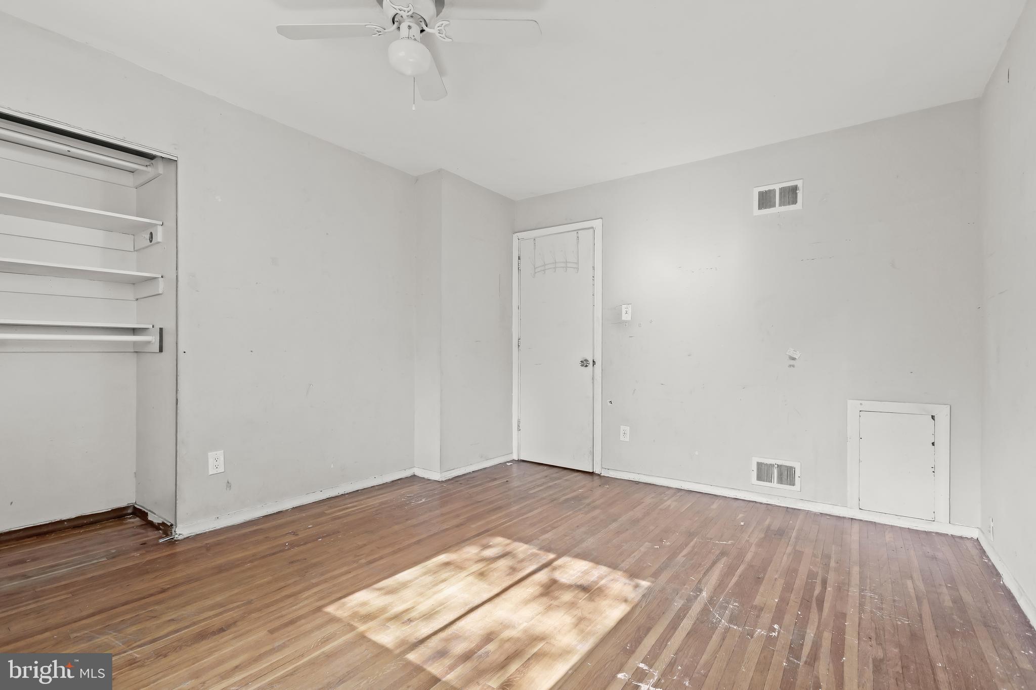 2217 Columbia Place Landover, MD 20785 - Photo 14 of 34 a view of a room with wooden floor and white walls