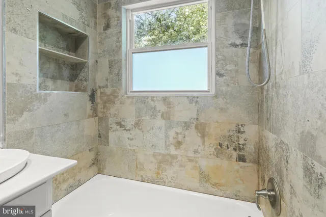 a bathroom with a sink and a shower