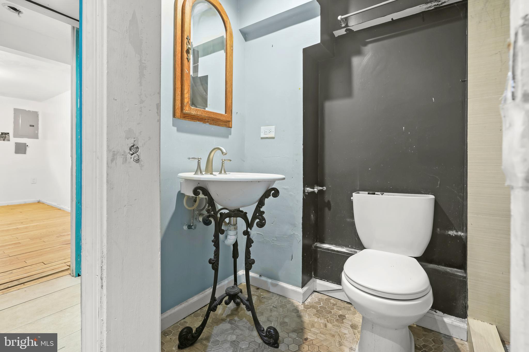 2217 Columbia Place Landover, MD 20785 - Photo 25 of 34 a bathroom with a toilet sink and mirror