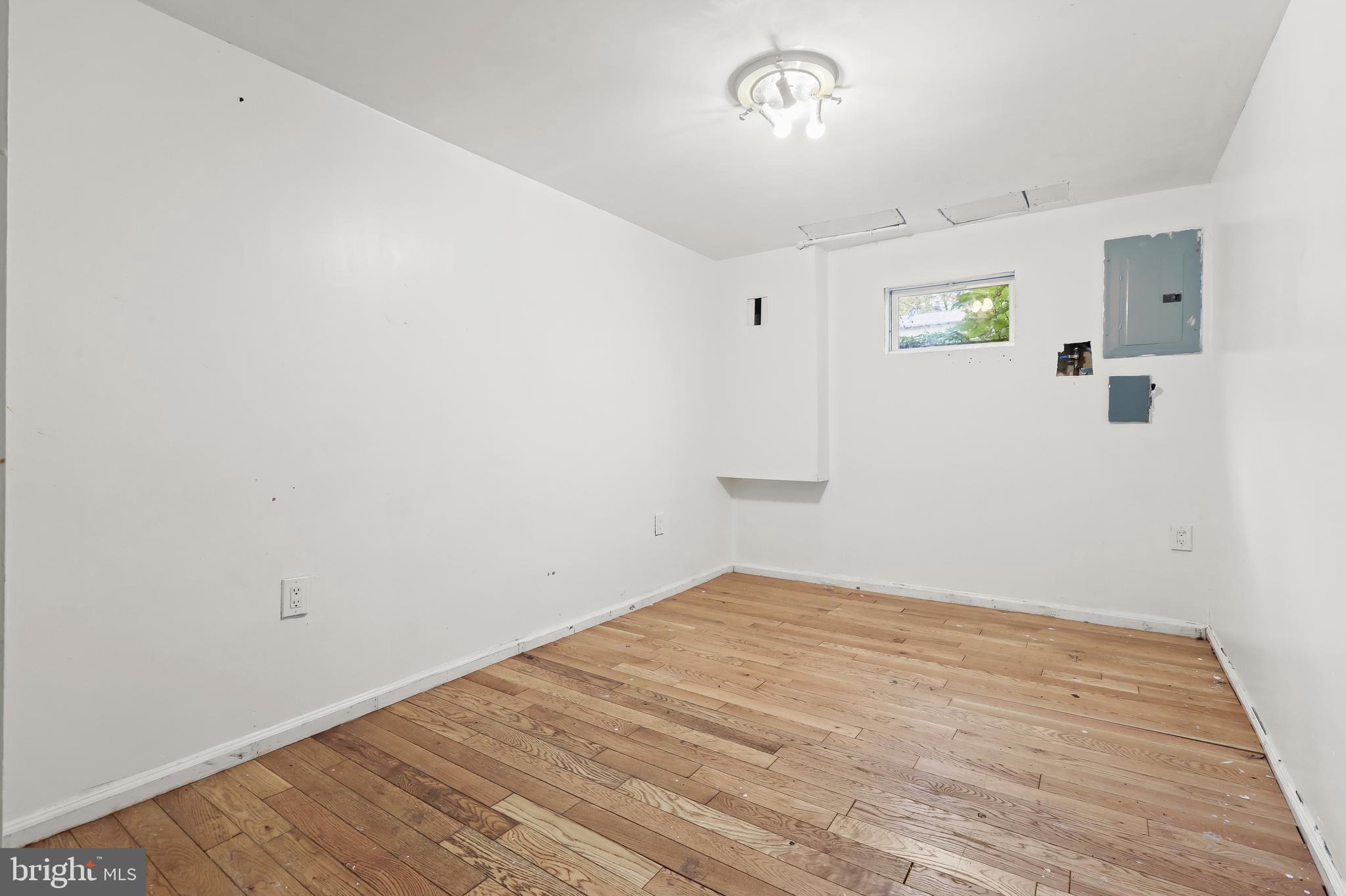 2217 Columbia Place Landover, MD 20785 - Photo 27 of 34 a view of empty room with wooden floor