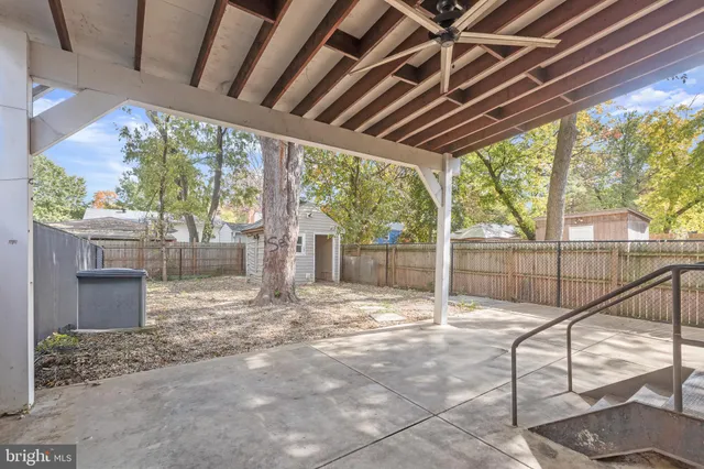 a view of a backyard with a small cabin