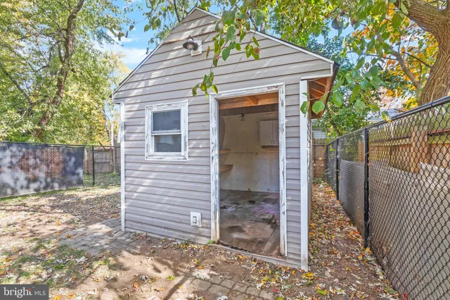 a view of a house with a yard and garage