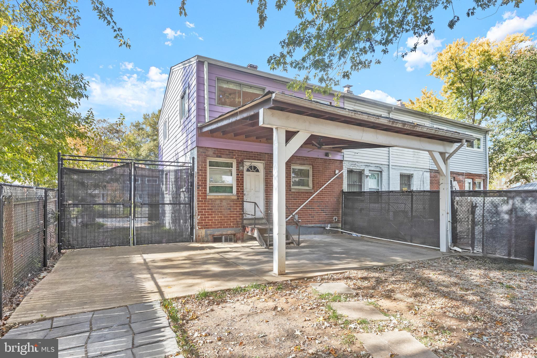 2217 Columbia Place Landover, MD 20785 - Photo 32 of 34 a view of a house with a backyard