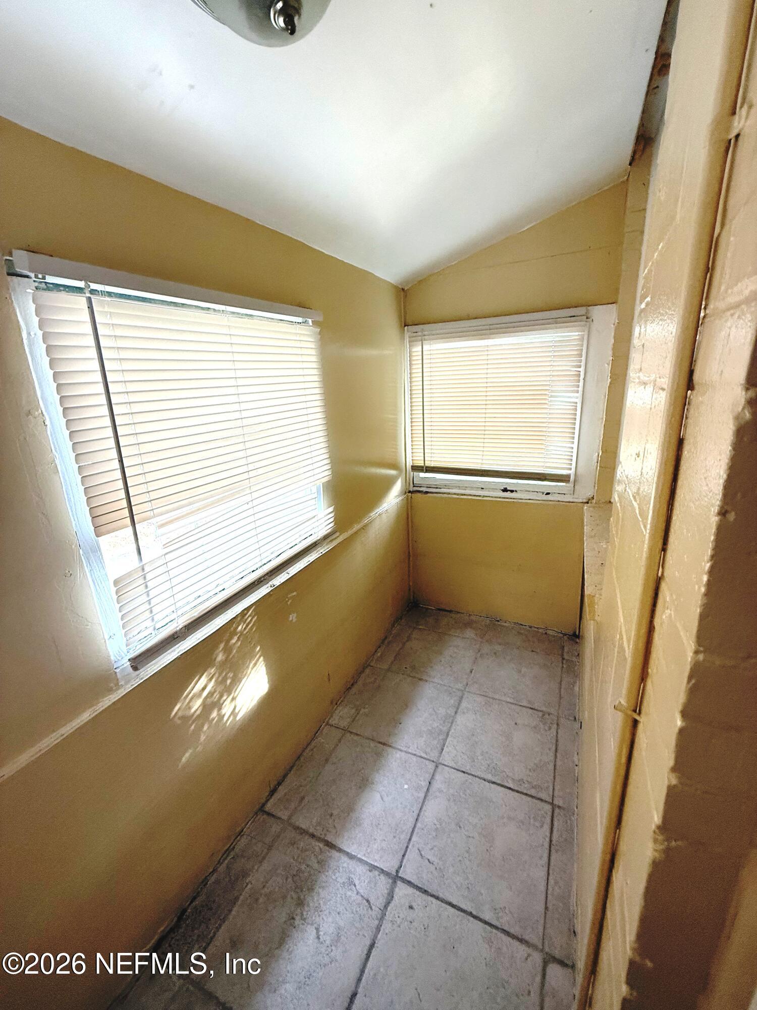 2036 Moncrief Road Jacksonville, FL 32209 - Photo 27 of 32 a view of walk in closet with window