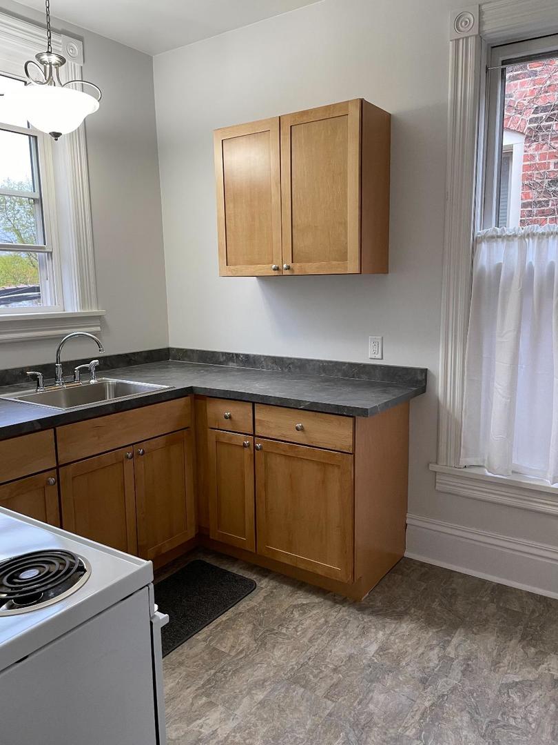 718 1/2 Columbus Street, Unit 2 Ottawa, IL 61350 - Photo 3 of 13 a kitchen with stainless steel appliances granite countertop a sink stove and cabinets