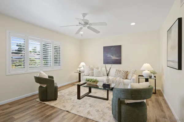 a living room with furniture and wooden floor