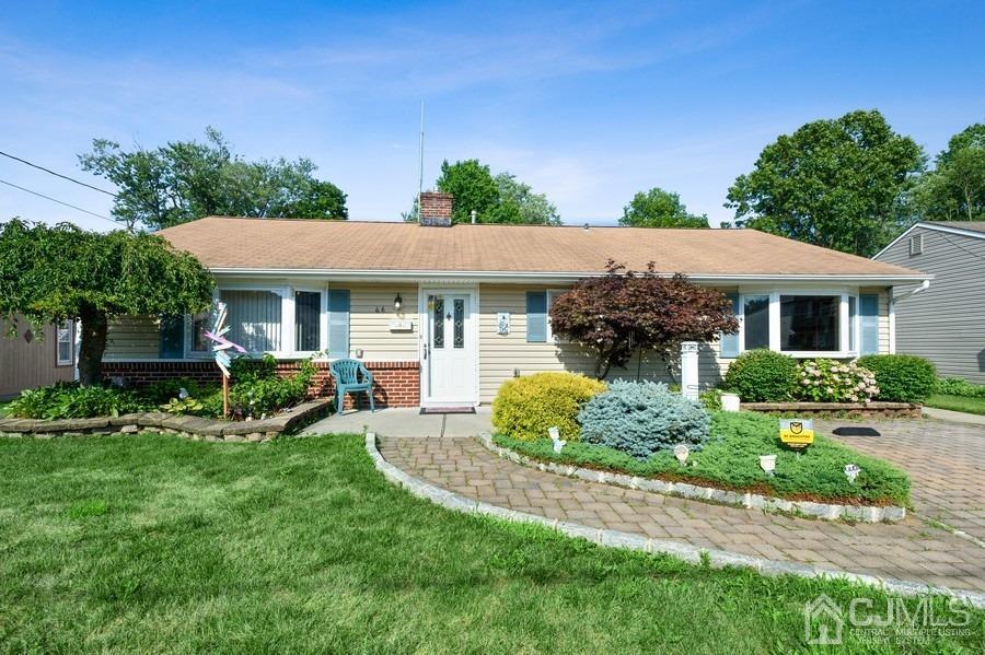 46 Weldon Road Edison, NJ 08817 - Photo 1 of 18 a front view of a house with a yard