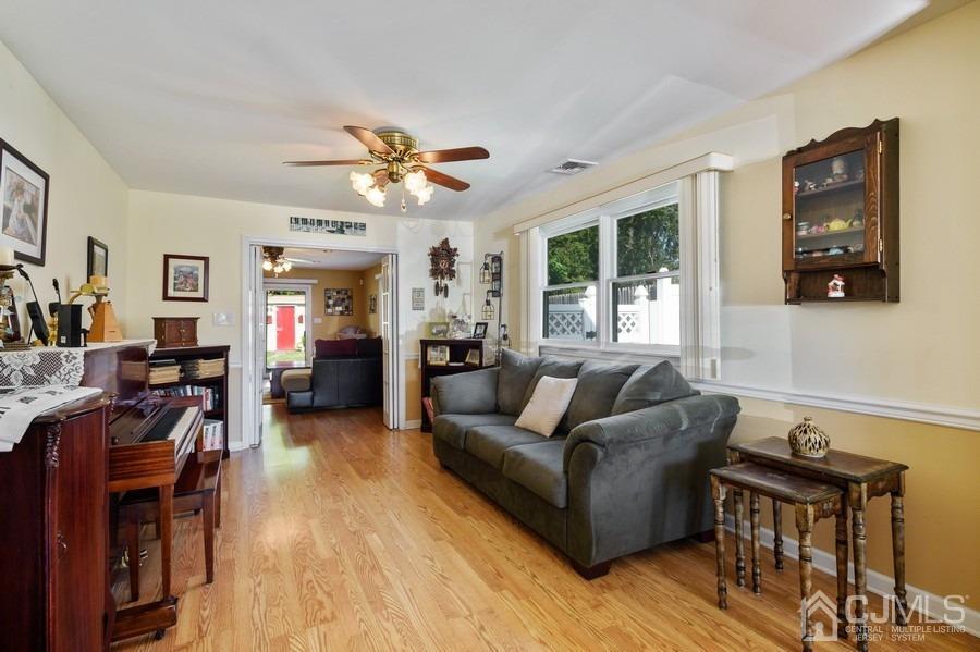 46 Weldon Road Edison, NJ 08817 - Photo 11 of 18 a living room with furniture and a large window
