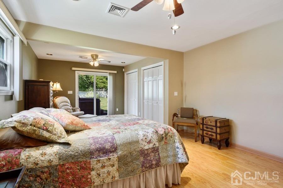 46 Weldon Road Edison, NJ 08817 - Photo 13 of 18 a bedroom with a bed couches and chandelier