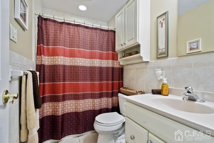 46 Weldon Road Edison, NJ 08817 - Photo 15 of 18 a bathroom with a sink toilet and shower