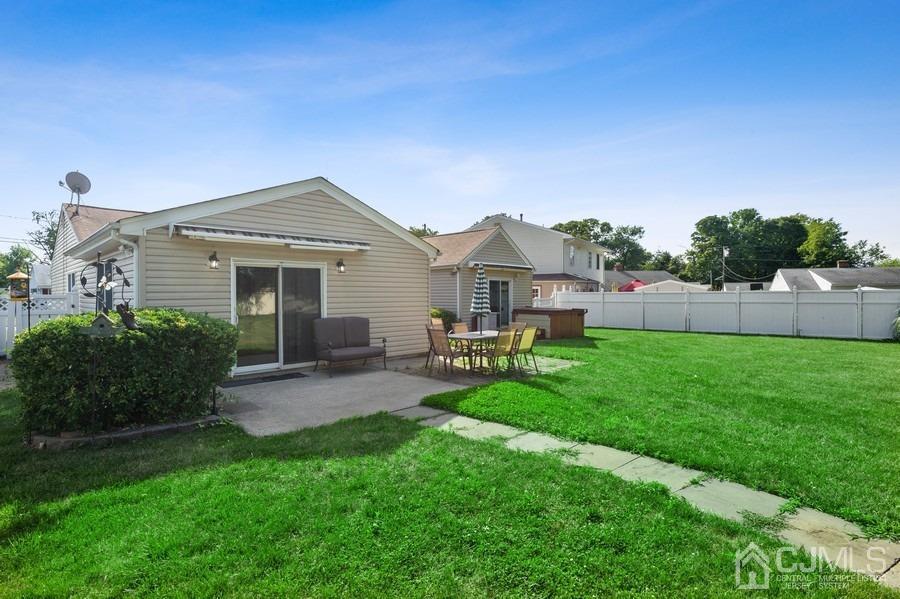 46 Weldon Road Edison, NJ 08817 - Photo 17 of 18 a view of a house with a backyard and a garden